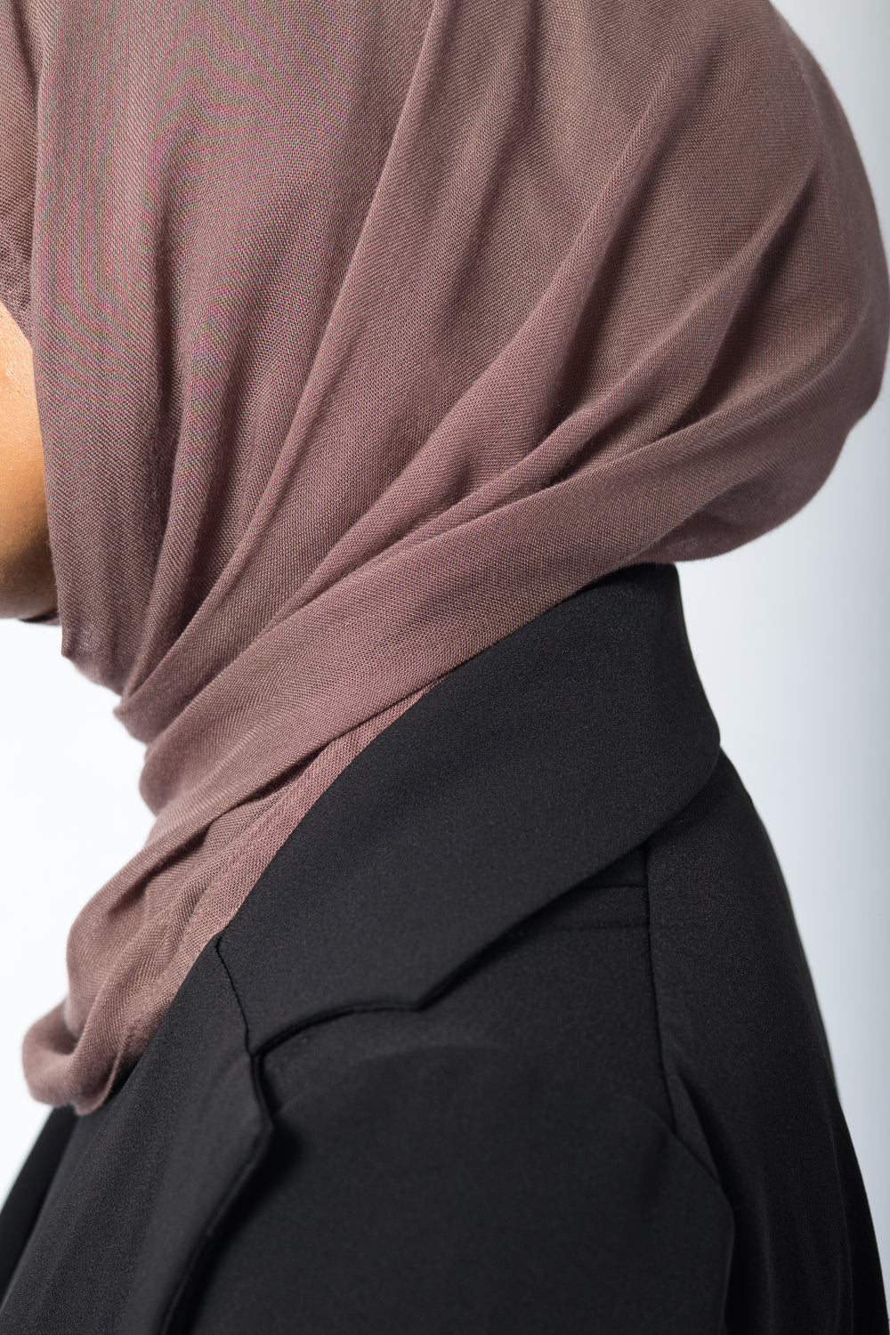 Close-up of blazer lapel and shoulder seam on Amani Pleated Blazer Set in premium crepe fabric