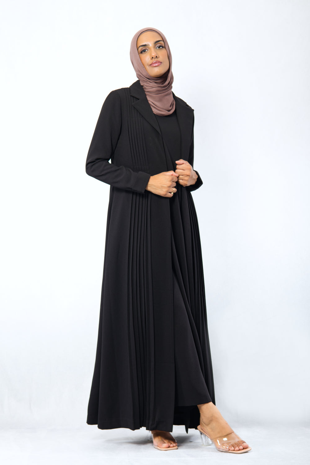 Modest black pleated blazer set with lapel collar and long length, styled for corporate or Eid occasions